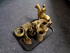 A tray containing antique and later brass ware to include embossed jugs, figure of horse and jockey,