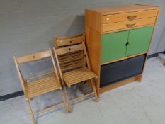 A contemporary office cabinet, fitted drawers with shutter door beneath,