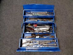 A metal concertina toolbox containing a large quantity of ring and adjustable spanners