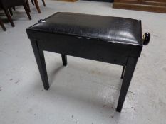 A painted adjustable piano stool