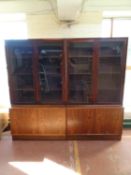 A pair of Danish mid 20th century double door glazed bookcases,