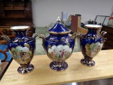 A three piece antique pottery transfer printed mantel piece garniture