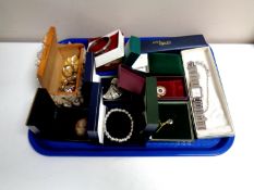 A tray containing a quantity of costume jewellery to include cameo brooch, bracelets,