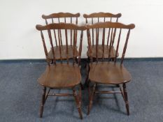 A set of four spindle back kitchen chairs