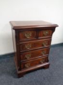 A Georgian style miniature five drawer chest,