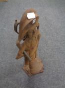 An antiquarian cast iron companion stand with companion pieces in the form of a town crier