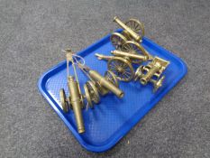 Five brass cannon ornaments