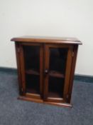 A 19th century mahogany double door table top cabinet