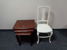 A painted bedroom chair together with a nest of three Nathan tables