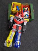 A box containing a bucket of Lego Duplo together with other plastic building blocks,