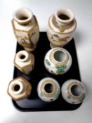 A tray containing two pairs of Japanese Satsuma vases together with three oriental ginger jars