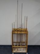 A Shakespeare twin sided fishing rod stand together with a quantity of split cane fly rods