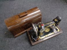 A cased 20th century Singer hand sewing machine