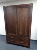 A contemporary double door wardrobe fitted two drawers beneath