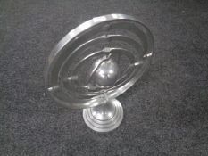 A chromed metal armillary sphere
