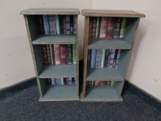 Two sets of narrow painted bookshelves