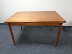 A 20th century teak extending dining table