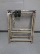 A folding metal grand piano dolly