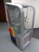 A shop display fridge bearing Red Bull advertising