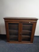 A 19th century oak double door bookcase top