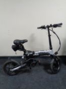A Lankeleisi G100 folding e-bike with keys,