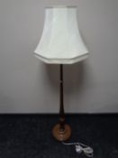 A beech standard lamp with shade
