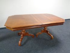 An American style twin pedestal extending dining table with two chairs together with a set of six