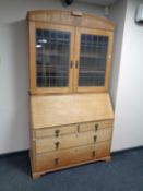 A 19th century oak leaded glass door bureau bookcase