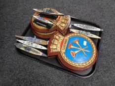 A tray containing four naval plaques together with seven plastic models,