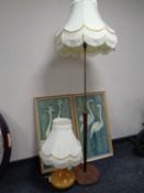 A 1970s teak and brass standard lamp with shade,