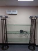 An ornate contemporary glass and metal three tier stand