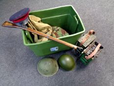 A box containing a large quantity of militaria including helmets, metal ammunition box,