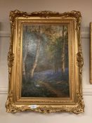 John Falconer Slater (1857-1937), Figures in woodland, oil on canvas, 32 x 49 cm, signed,