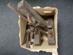 A box containing antique wood planes