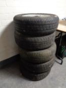 Four alloy wheels and five further car wheels