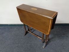 An Edwardian inlaid mahogany Sutherland table