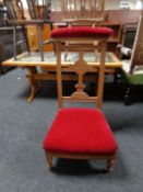 A 19th century prayer chair in oak frame