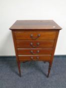 An Edwardian inlaid mahogany four drawer music chest