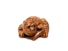 A carved Chinese hardwood netsuke - Mythical sea creature