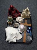 A tray containing ornamental Buddha figure, large shell,