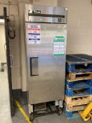 A stainless steel commercial 'True' fridge