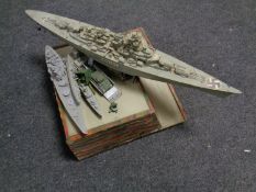 A model warship together with further model ships etc and stand