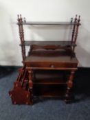 A walnut low coffee table together with a magazine rack and a telephone table