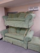A traditional style three and two seater settees plus matching footstool