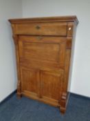 A 19th century oak secretaire cabinet