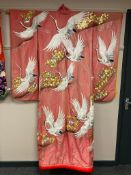 A Japanese kimono on pink background,