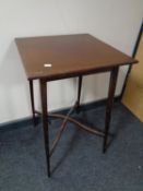 An Edwardian stained beech plant stand