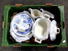 A box containing seven pieces of 19th century blue and white dinner ware