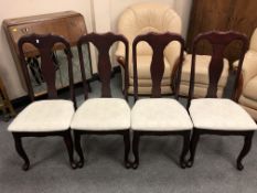 A set of four reproduction Queen Anne style dining chairs