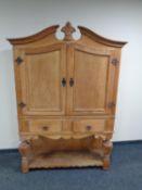 A traditional style double door sideboard fitted with two drawers